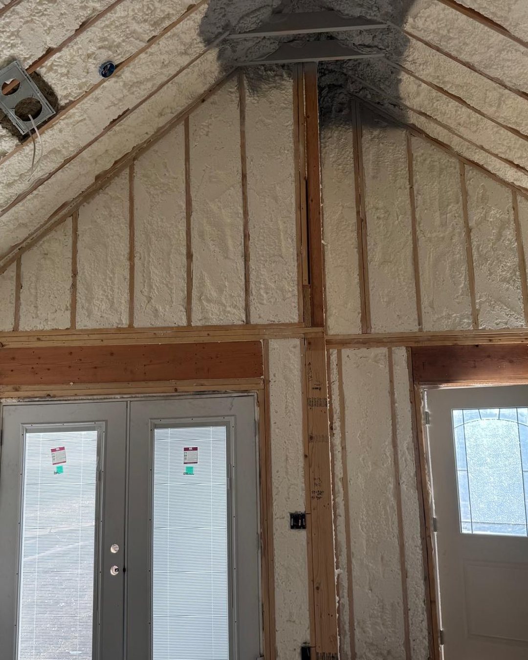 Gable wall with French doors, framed and sprayed with foam insulation