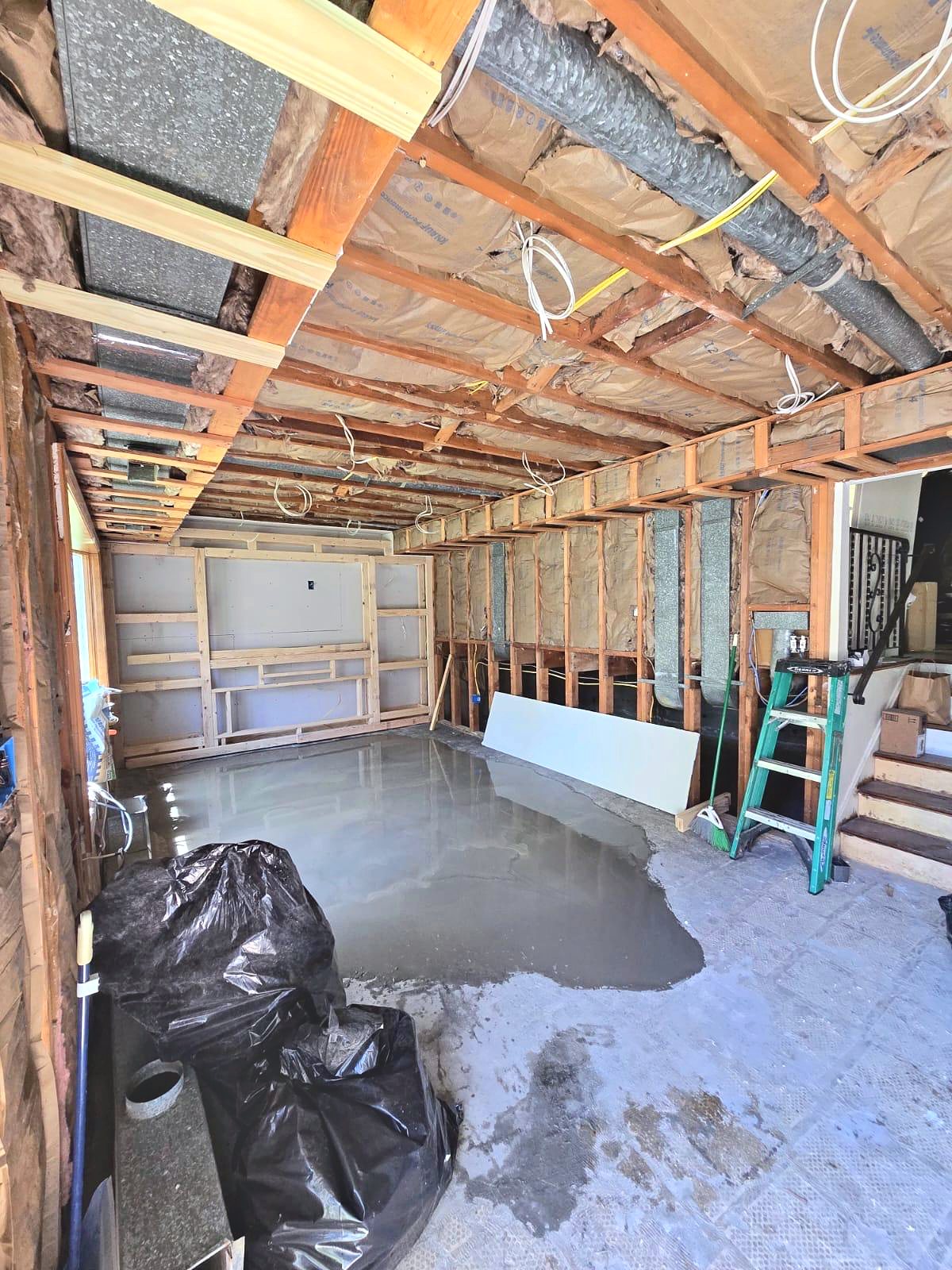 Basement framing with ductwork and insulation exposed