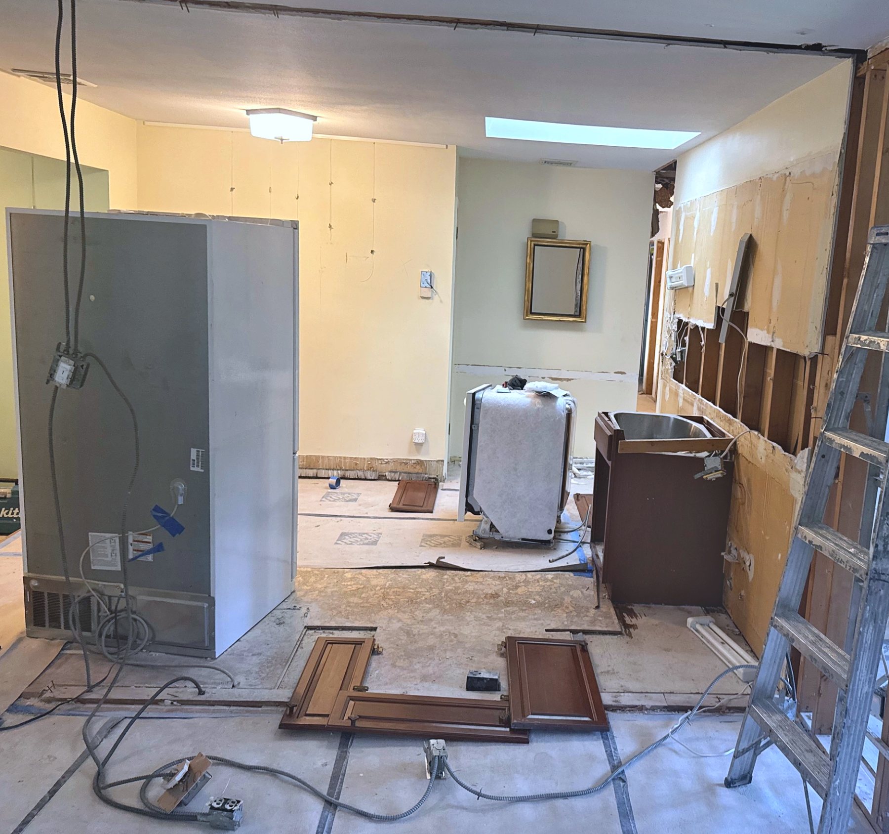 Kitchen during demolition with old cabinets removed