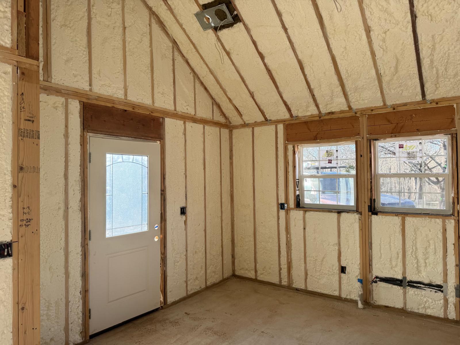 Spray-foam insulated walls around the entry door and kitchen windows
